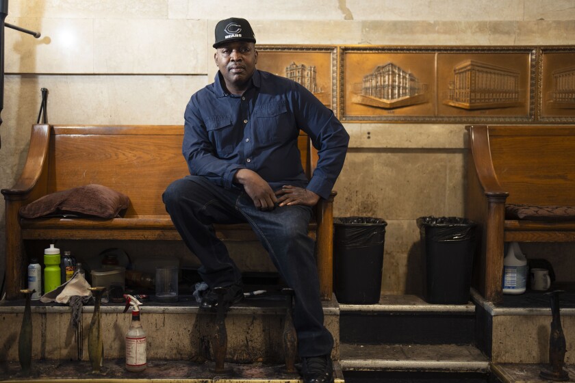 Steve Fullerton sits at Steve's Shoe-shine Parlor at City Hall.