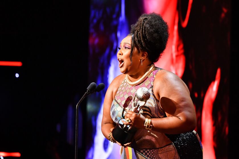 Lizzo accepts the Entertainer of the Year award onstage during the 51st NAACP Image Awards on Saturday night.