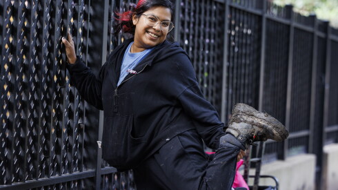 Alyssa Espinosa, a North Lawndale resident, shows off her boot outside Douglass Park on Monday, the day after Riot Fest wrapped up.