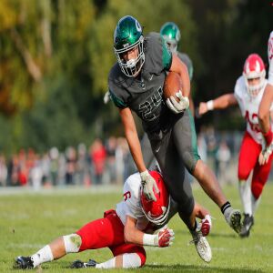 Glenbard West’s Nic Seifert (24) runs past Hinsdale Central’s Guy Henry Goss (6).