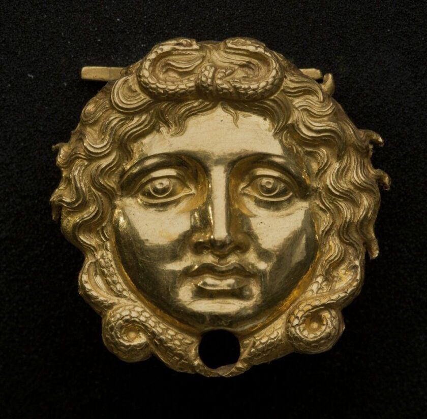Gold gorgon head in the Field Museum exhibition, “The Greeks: From Agamemnon to Alexander the Great.” (Courtesy of Museum of the Royal Tombs of Aigai, Vergina)