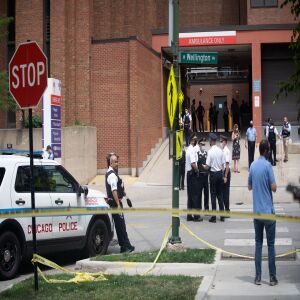 Police officers gather outside Advocate Illinois Masonic Medical Center after an officer was shot at the 25th District police station on the Northwest Side, Thursday, July 30, 2020.