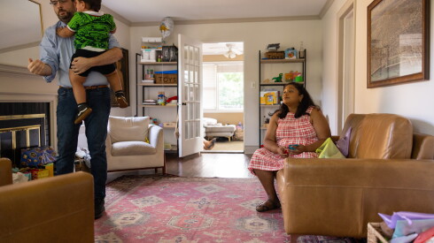 Eleanor Grano (right) in the living room of her Riverside home with husband E.J. Fagan and their 2-year-old son Cinco on Sept. 15, 2026.