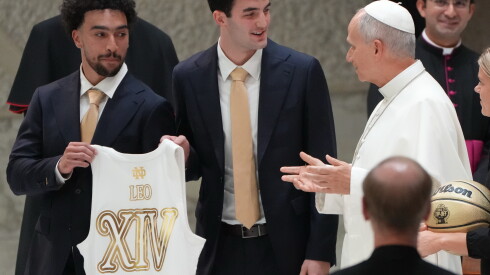 Notre Dame's guards Braeden Smith and Logan Imes present Pope Leo XIV with a personalized Notre Dame's jersey and basketball