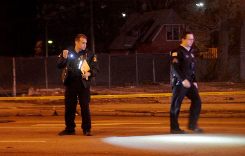 Officers respond to a shooting Friday evening in the 2300 block of West Ogden. | Justin Jackson/Sun-Times