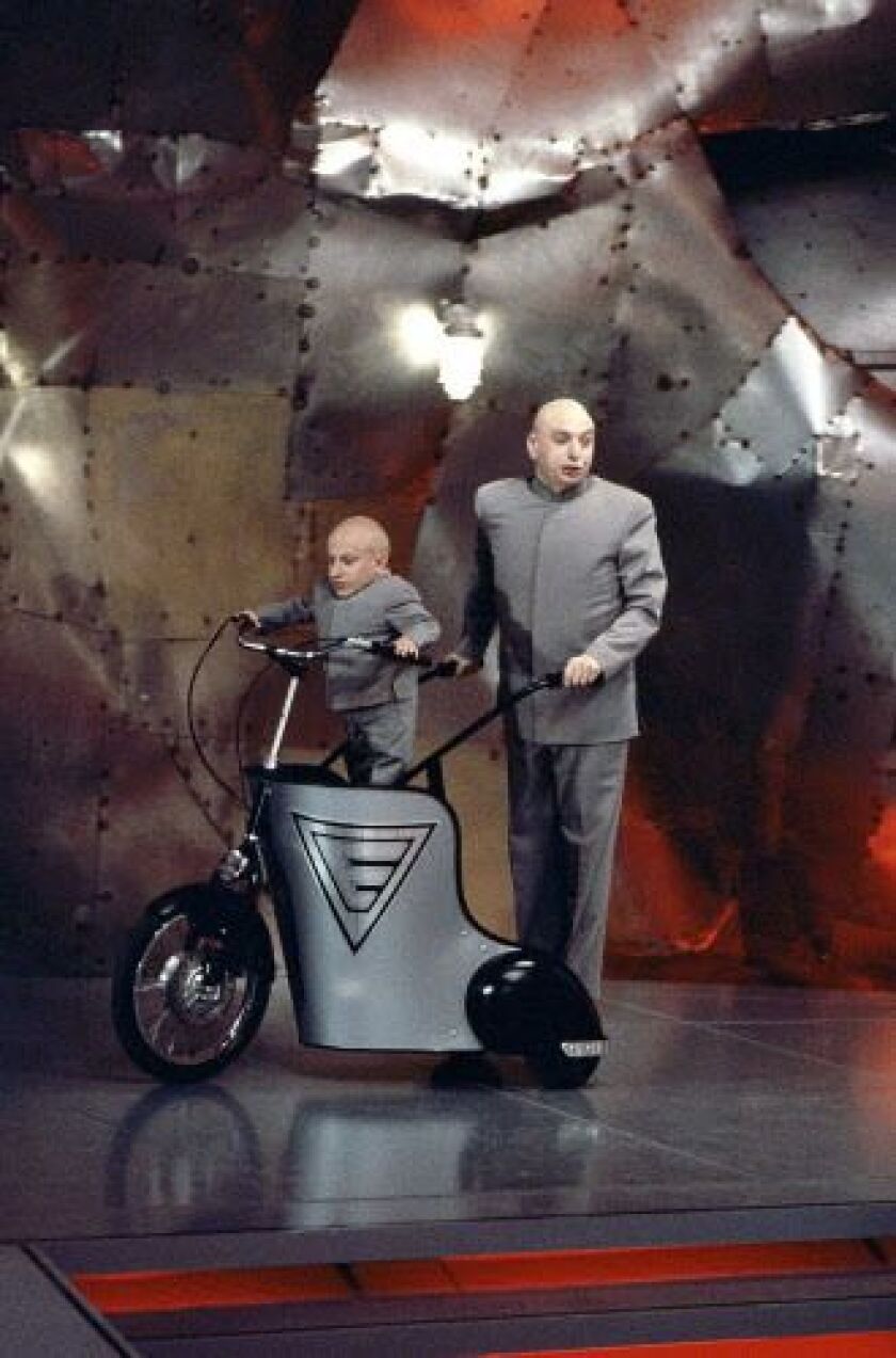 Verne Troyer and Mike Myers in “Austin Powers: The Spy Who Shagged Me.” | New Line Cinema