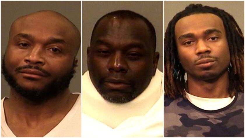 Three men are charged with robbing a Verizon store at gunpoint