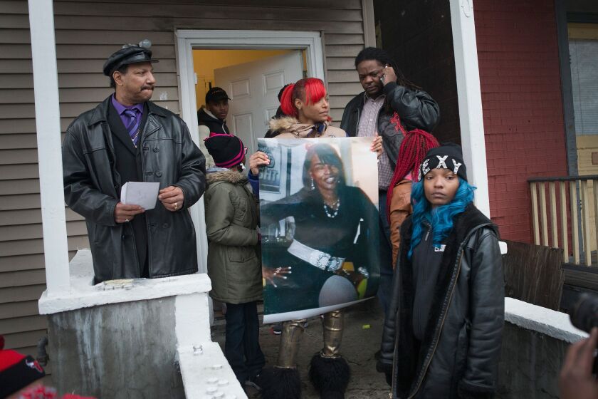 Friends and relatives held a vigil on Dec. 27 outside the home where Bettie Jones and Quintonio LeGrier were shot and killed. | Getty Images