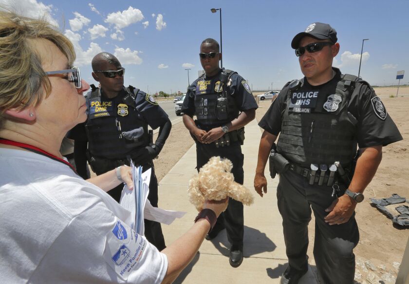 Randi Weingarten tries to deliver a teddy bear and other items for children to federal agents at the port-of-entry, June 26, in Fabens, Texas, along the international border where immigrant children are being held. (AP Photo/Matt York)