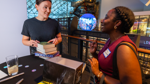 Author Veronica Roth with fellow book enthusiast Shay Moore, 26 years old from Schaumburg, Illinois during “A Celebration of The Sixth Faction” at Navy Pier in Chicago, IL on Wednesday, August 12, 2026.