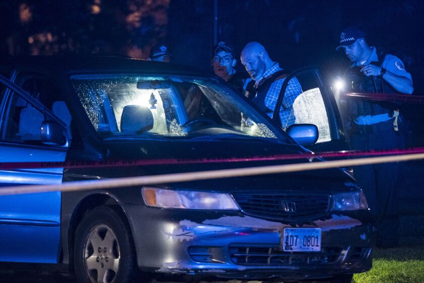Police investigate a person shot multiple times Tuesday morning in the fist block of Marquette Road. | Tyler LaRiviere/Sun-Times