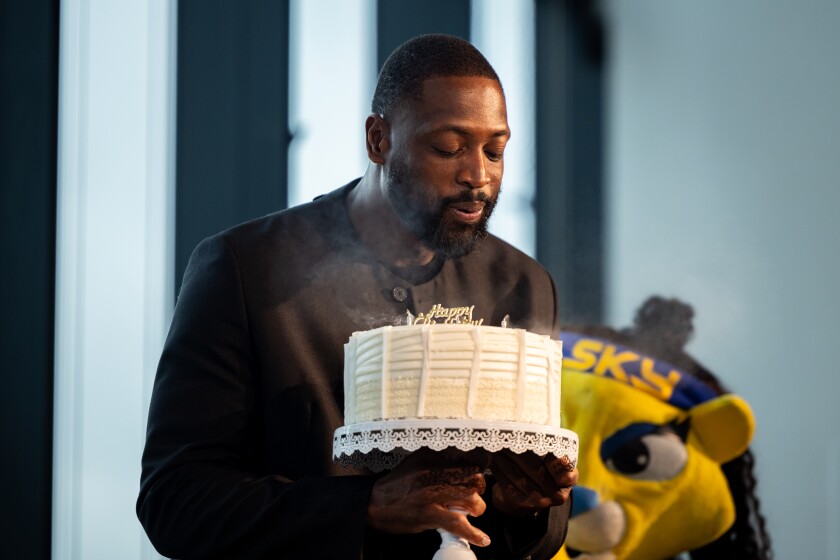 Dwyane Wade blows out candles on a birthday cake during a launch event downtown to celebrate the Chicago’s selection as the host city for the 2026 AT&T WNBA All-Star Weekend, Friday, Jan. 16, 2026. | Candace Dane Chambers/Sun-Times.