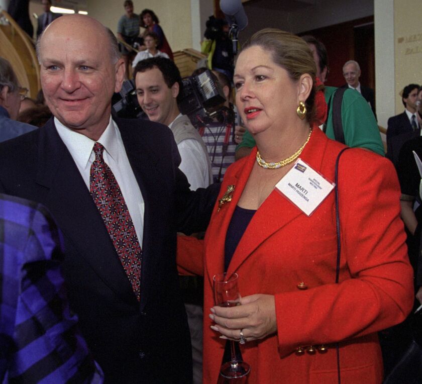 H. Wayne Huizenga and his wife Marti greeting Blockbuster Entertainment stockholders Sept. 29, 1994, in Fort Lauderdale. | AP