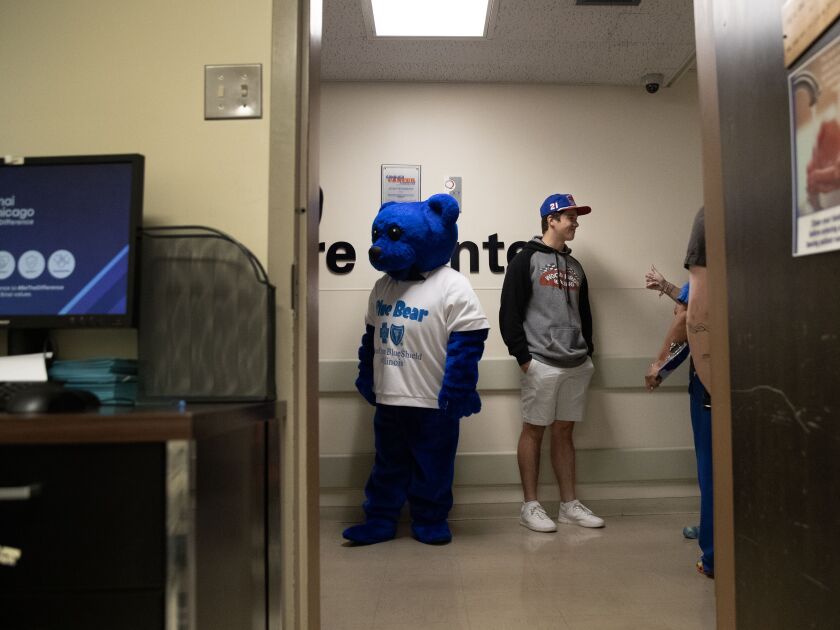 NASCAR driver Harrison Burton talks with hospital staff on Thursday, June 29, 2023 at Mount Sinai Hospital in Chicago.