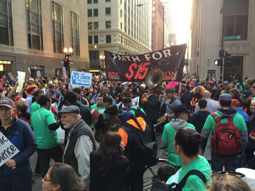 <small><strong>Protesters seeking a minimum wage increase gather downtown Wednesday evening at La Salle and Jackson near the Board of Trade. | John O’Neill/Sun-Times</strong></small>