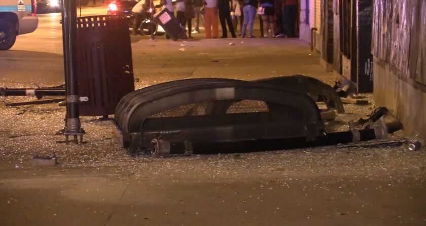 The roof of a CTA bus shelter rests on a South Shore sidewalk after being smashed by an SUV fleeing a shooting late Saturday. | Network Video Productions