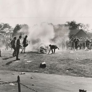 Police threw a smoke bomb and the yippies picked the bomb and threw it back. | Sun-Times photo by Carmen Reporto 8/22/68
