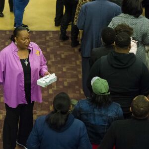 A woman with the church hands out tissues to mourners as they pay their final respects at the wake for Jemel Roberson, Saturday, Nov. 24, 2018, in Chicago. Roberson was shot and killed by Midlothian police on Nov. 11. | Tyler LaRiviere/Sun-Times