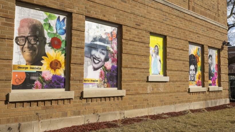 Five murals appear on the brick walls of the Lazarus Apartments in North Lawndale.