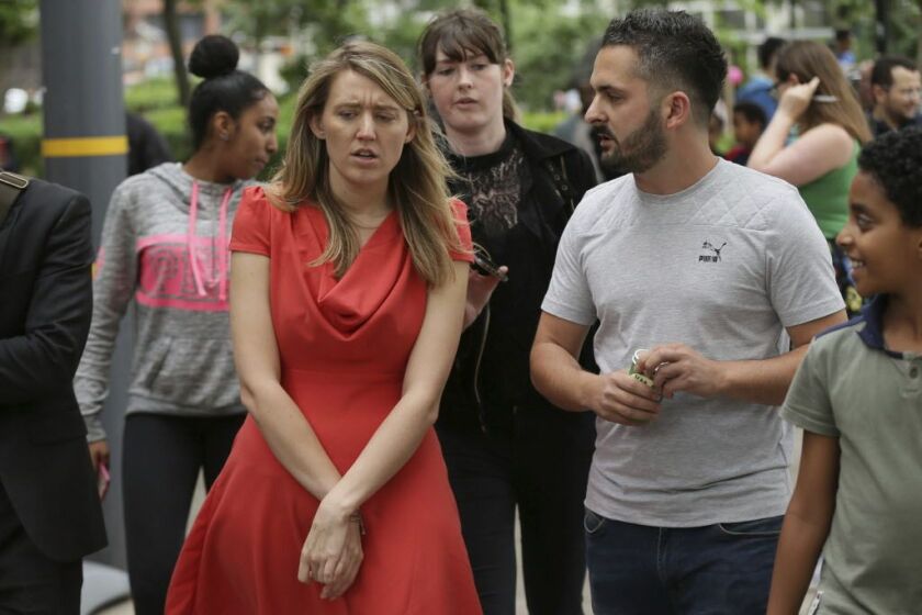 Camden Council leader Georgia Gould (second from left) speaks to members of the public outside Swiss Cottage Leisure Centre where residents are being temporarily housed after being evacuated from the Chalcots Estate, in the borough of Camden, north London