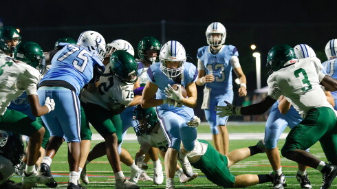DePaul Prep's Zach Stewart (4) carries the ball against Lane.