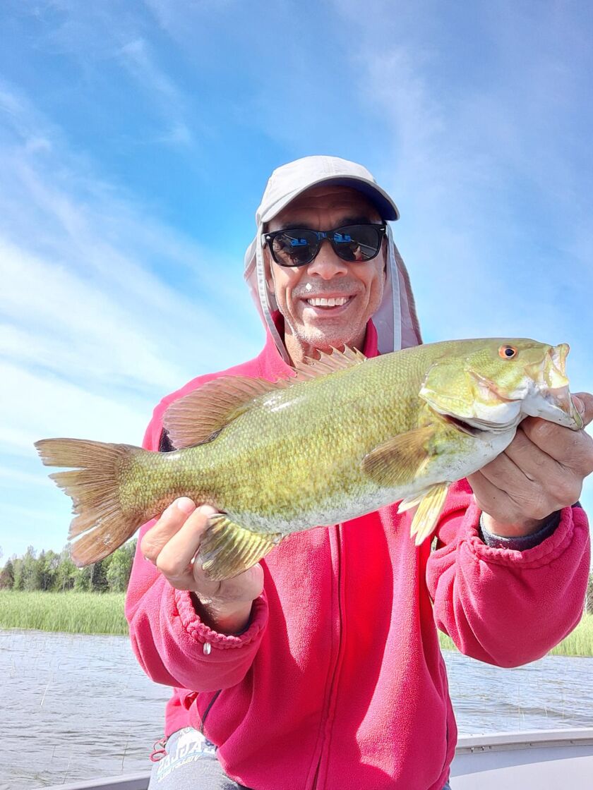 Rob Abouchar with a smallmouth bass from Door County in Wisconsin. Provided photo