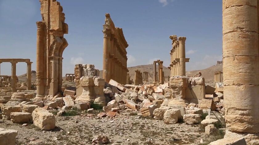 Damage at the ancient ruins of Palmyra, central Syria, shown when the town was first retaken from Islamic State militants last year. | SANA, distributed by the Associated Press