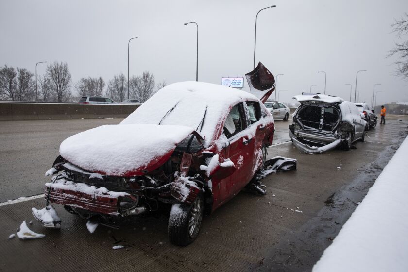 Illinois State Police investigate the scene of a massive pileup crash involving nearly 60 vehicles, sending more than a dozen people to hospitals, in the inbound lanes of the Kennedy Expressway near North Avenue, Wednesday morning, April 15, 2020.