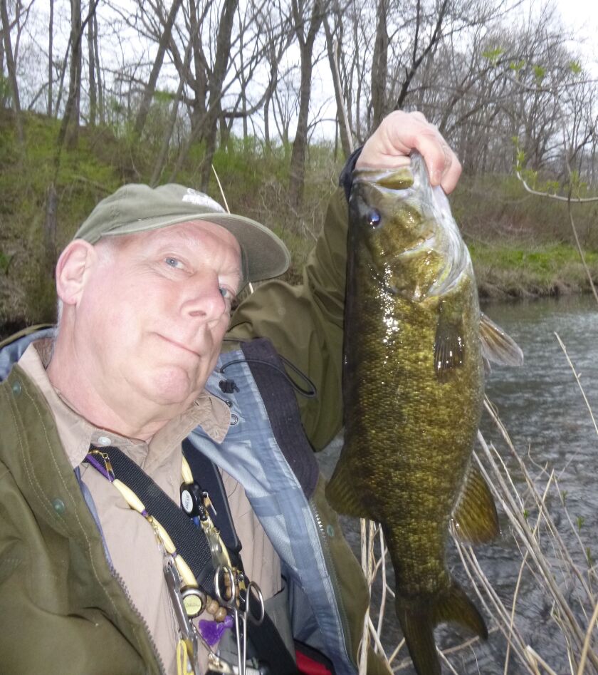 Chuck Roberts with a fine Fox River smallmouth, caught on the fly. Provided photo