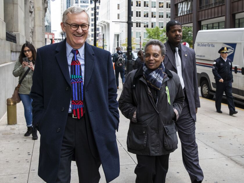 Mayor Lori Lightfoot leaves City Hall with Corporation Counsel Mark Flessner.