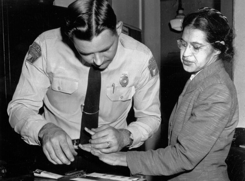 Rosa Parks is fingerprinted by police Lt. D.H. Lackey in Montgomery, Ala., two months after refusing to give up her seat on a bus for a white passenger on Dec. 1, 1955. She was arrested with several others who violated segregation laws. Parks’ refusal to