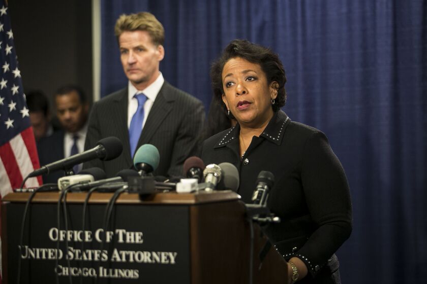 U.S. Attorney Zachary Fardon looks on as Attorney General Loretta Lynch announces the release of a report that found reasonable cause that the Chicago Police Department engaged in a pattern of using excessive force during a press conference at the Dirksen