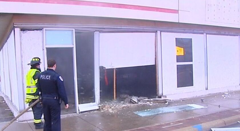 Authorities investigate after a car slammed into a Skokie building Saturday morning. | Network Video Productions