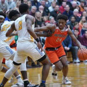 Brother Rice’s Marquise Kennedy (24) tries to slide around Simeon’s Kejuan Clements (0), Friday 03-01-19. Worsom Robinson/For Sun-Times