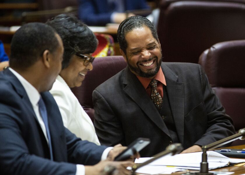 Alds. Anthony Beale (9th) laughs with Alds. Michelle Harris (8th) and Gregory Mitchell (7th) during Mayor Lori Lightfoot’s first Chicago City Council meeting at City Hall, Wednesday, May 29, 2019.