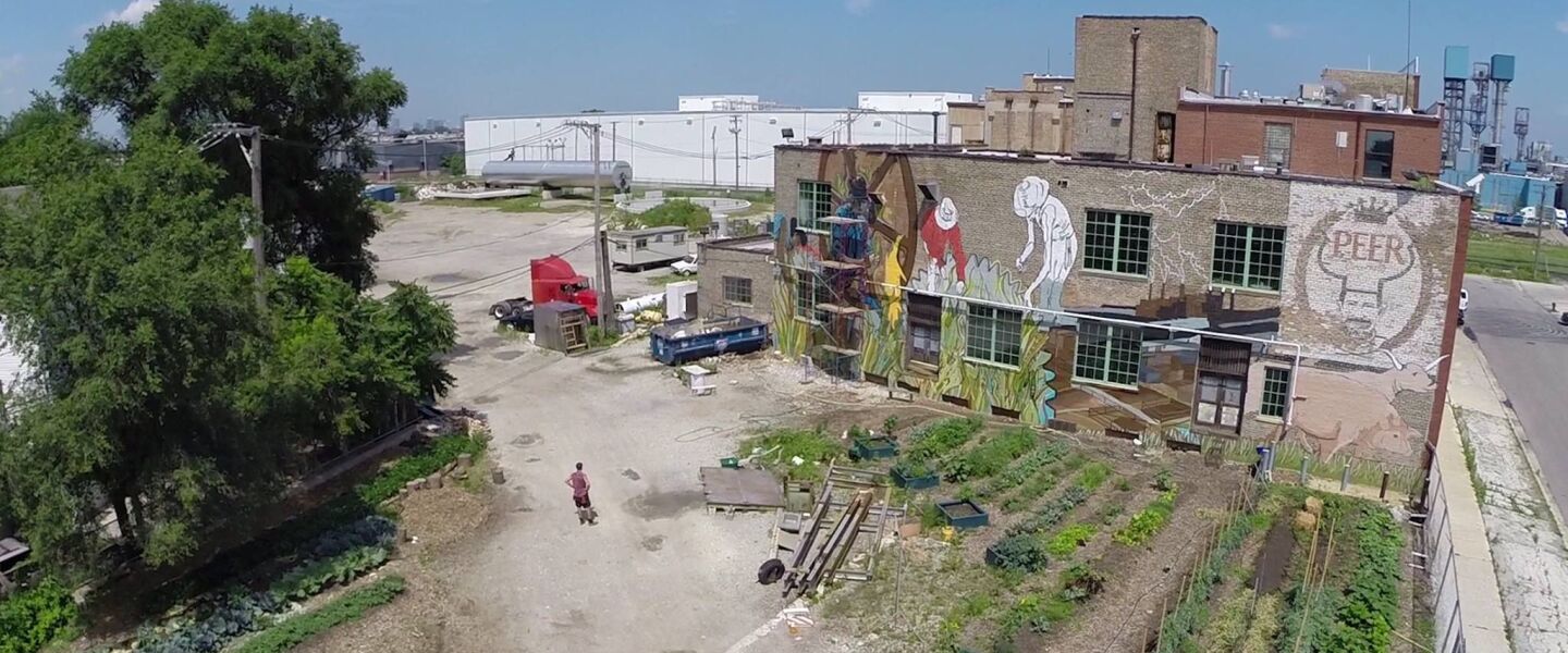 This is a view from above of the mural at 1400 W. 46th St. as it was still in progress. The adjacent patch of urban farm land also can be seen.