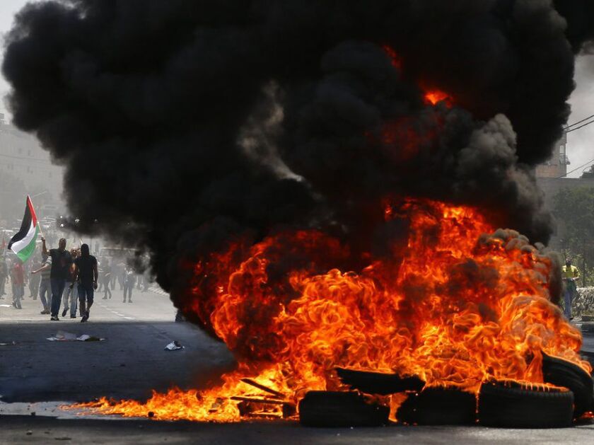 Palestinians clash with Israeli forces after a rally to mark the 70th anniversary of what Palestinians call their “nakba,” or catastrophe — the uprooting of hundreds of thousands in the Mideast war over Israel’s 1948 creation, in the West Bank city of Bet
