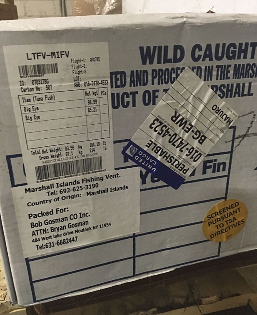 Boxes containing imported headless bigeye tuna sit on a pallet, marked to be picked up by a driver from the Bob Gosman Co., at the New Fulton Fish Market in New York. Bob Gosman Co., a supplier for Sea to Table, gets some of its fish from Fulton, a place