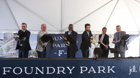 Ald. Scott Waguespack (32nd) (from left), JDL Development CEO Jim Letchinger, Mayor Brandon Johnson, Kayne Anderson Real Estate Chief Investment Officer David Selznick, Chicago Department of Planning and Development Commissioner Ciere Boatright and Ald. Brian Hopkins (2nd) toss shovels of dirt during the groundbreaking for Foundry Park.