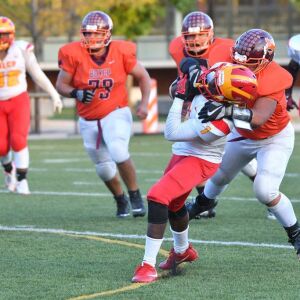 Back of the Yards’ Ricky Herrera tackles North Lawndale’s LeDarius Toliver (1). Worsom Robinson/For the Sun-Times.