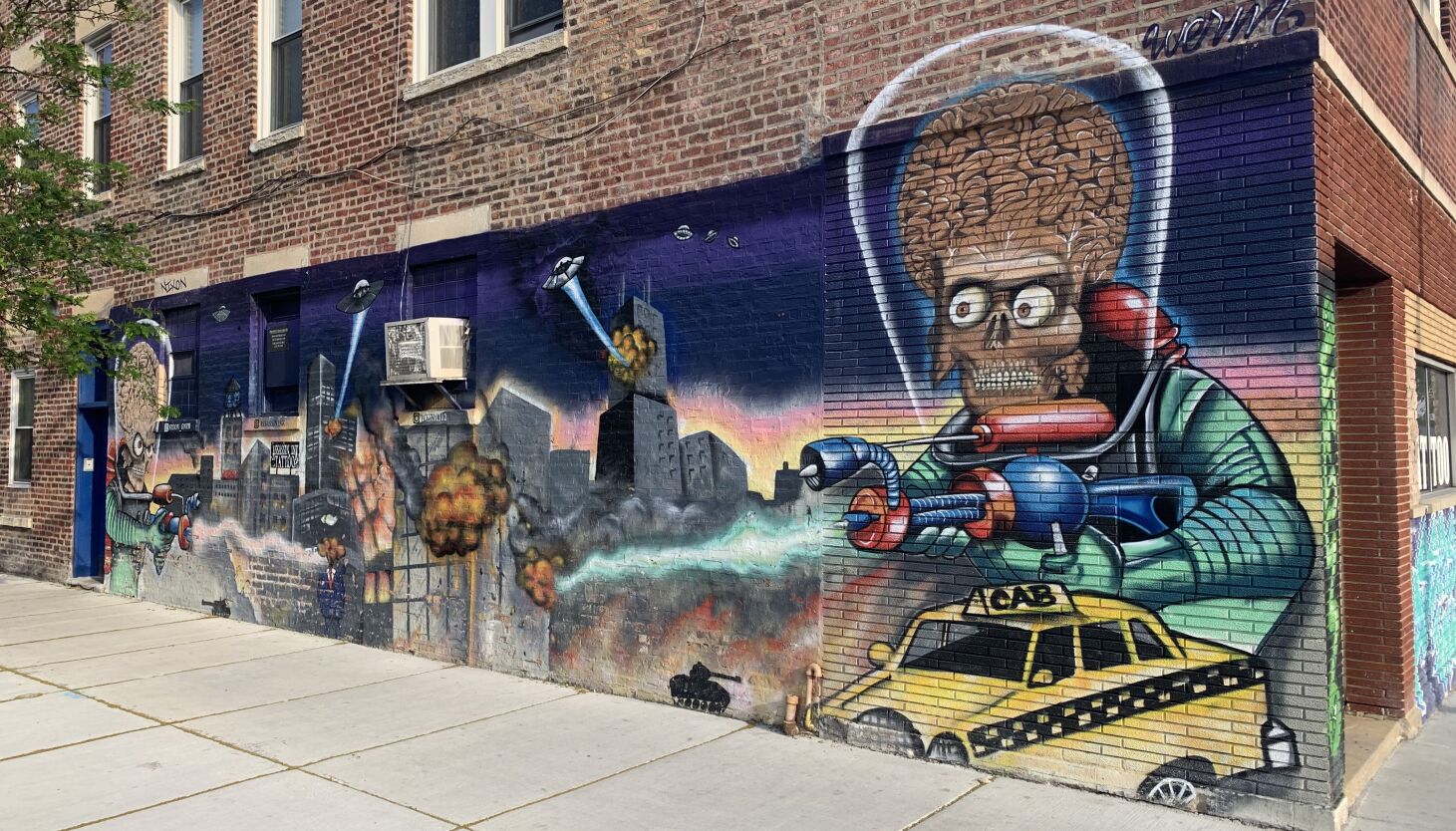 NextImg:When your kids love ‘Mars Attacks!’ Chicago tattoo shop owner figured you need a mural with aliens