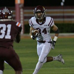 Loyola’s Tyler Flores (24) finds room to run. Worsom Robinson/For the Sun-Times.