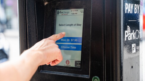 A driver pays for parking on ParkChicago’s parking machine on North Clark Street in Andersonville, Tuesday, Sept. 15, 2026.