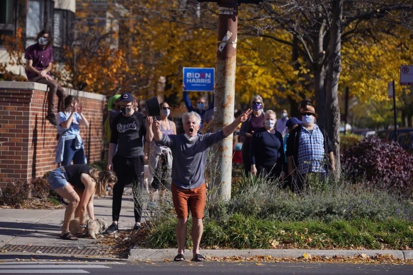 Supporters of President-elect Joe Biden celebrate Saturday in Rogers Park.