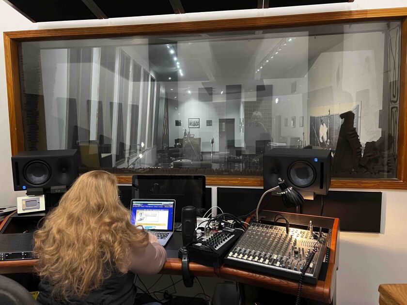 Janine Judge, executive director of Willie Dixon’s Blues Heaven Foundation, Inc., sits in the sound booth in the upstairs recording studio at Chess Records in Chicago on Feb. 27, 2022. Some of the biggest names in blues recorded hits in Chess’ recording studio, including, Muddy Waters, Chuck Berry’ and Bo Diddley.