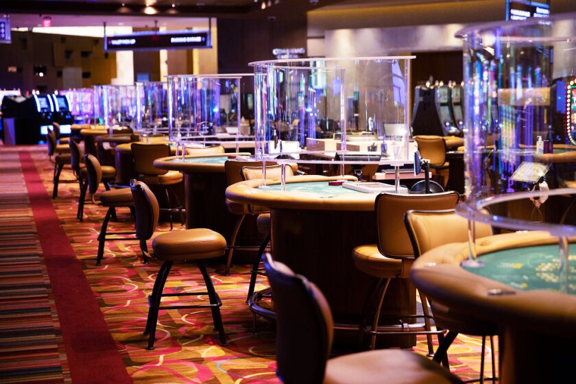 Plexiglass partitions are set up to separate dealers from players at Rivers Casino in Des Plaines.