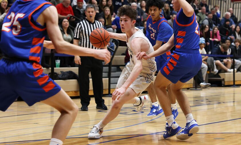 Lake Park’s Camden Cerese (1) works his way through the Fenton defenders.