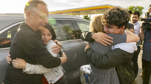 Ricardo Navarrete and his mother Liliana hug supporters after Ricardo was released from immigration detention.