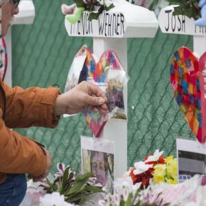 Mourners pay their respects at a memorial for the five people killed two days earlier in a mass shooting at the Henry Pratt Company in Aurora, Sunday afternoon, Feb. 17, 2019. | Ashlee Rezin/Sun-Times