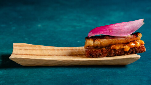 This caramelized eel dish at Smyth is served on brioche toast with a magnolia petal.